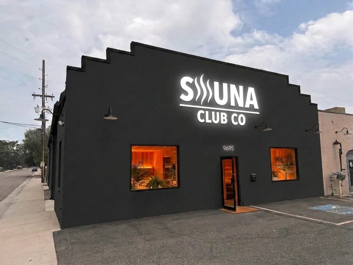 Exterior of the Sauna Club Co Wheat Ridge building at dusk